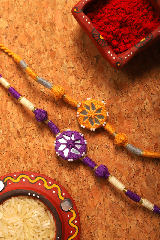 Antarang- Patwa mirror work, 100% cotton, Bhai Rakhi set. Purple- Yellow ocher Made by Divyang rural women.